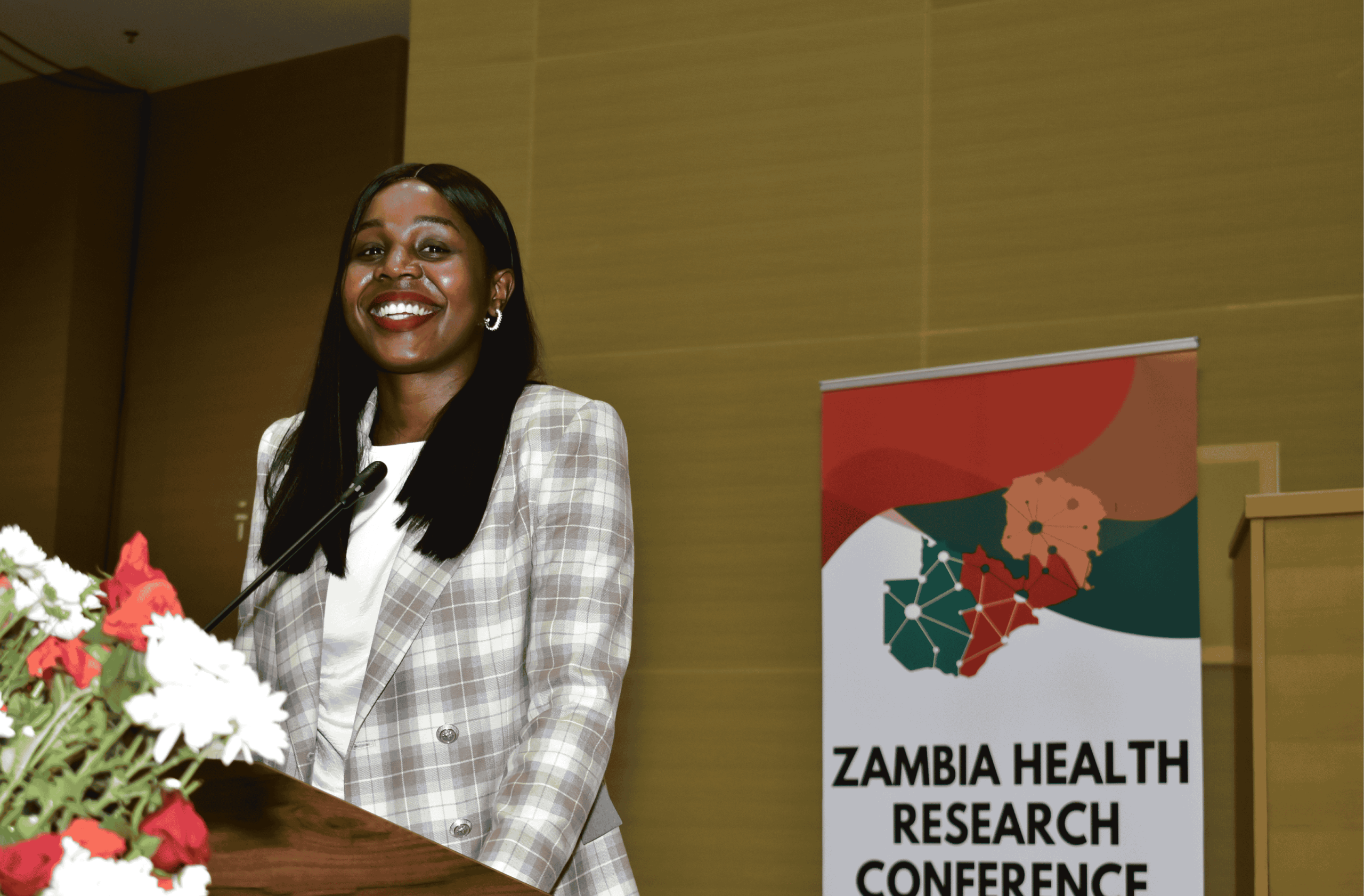 Diverse group of researchers, policymakers, students and community members attending a health conference